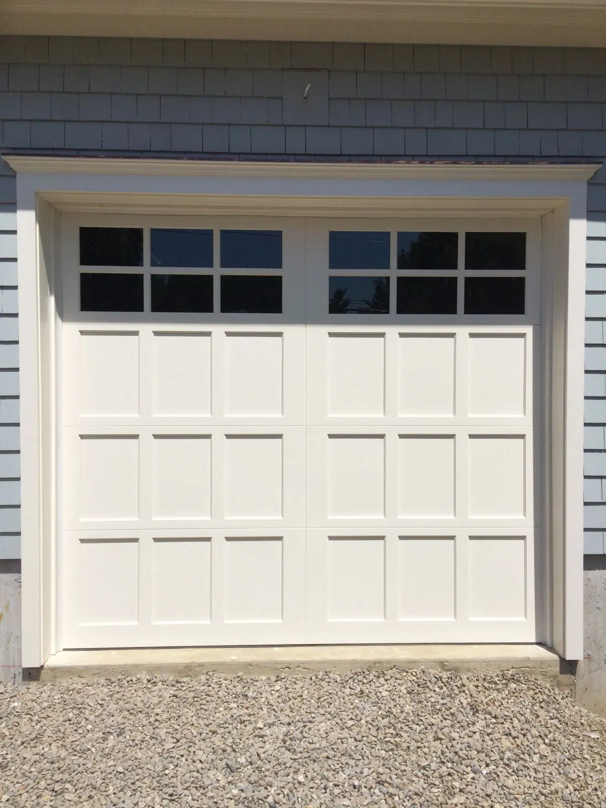 A carriage-style garage door serviced by Apex Door
