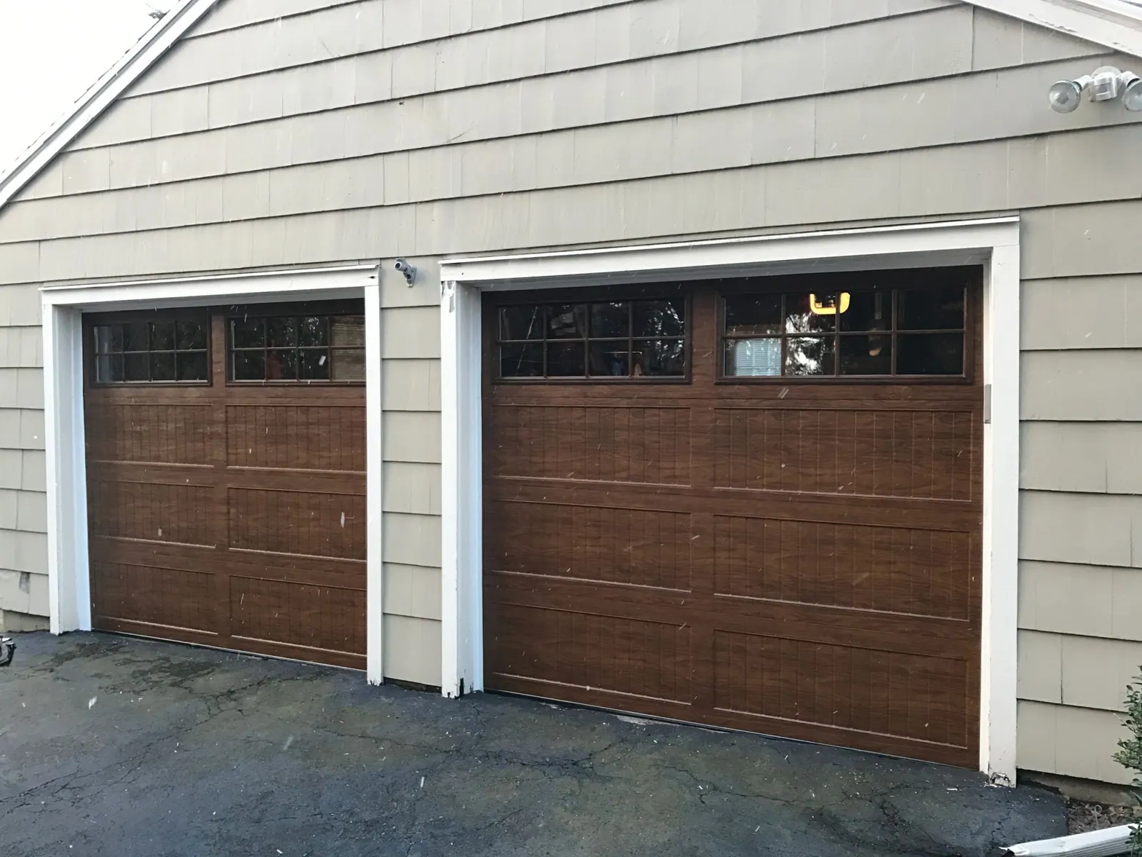 A wood-look two-car garage door installed by Apex Door